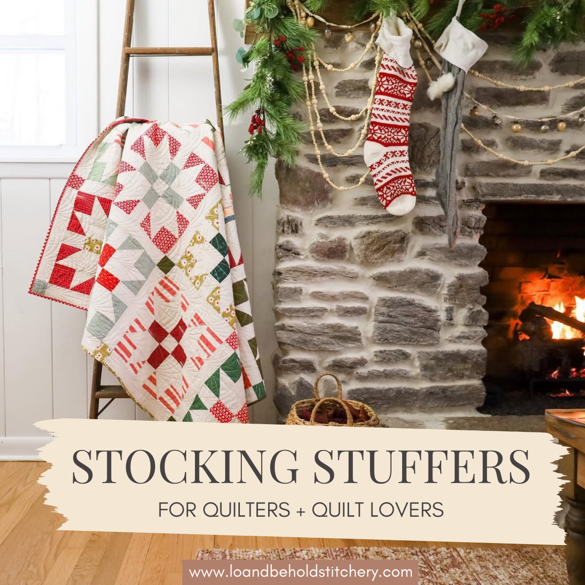 Christmas Joy quilt draped on a quilt ladder next to a roaring fireplace with stockings and garland