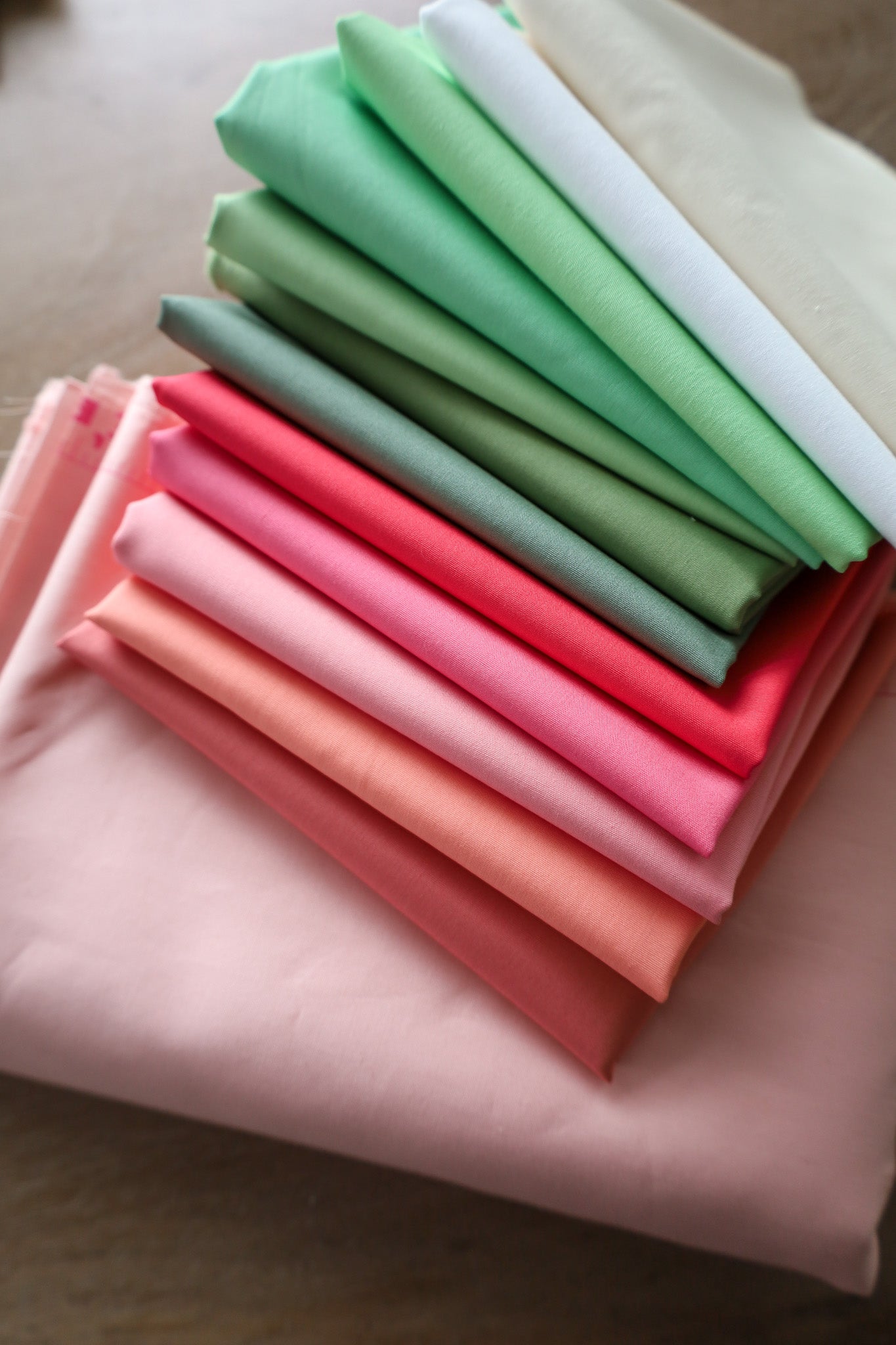 Fabric for Granny Patch Cherry Blossom quilt kit on a table