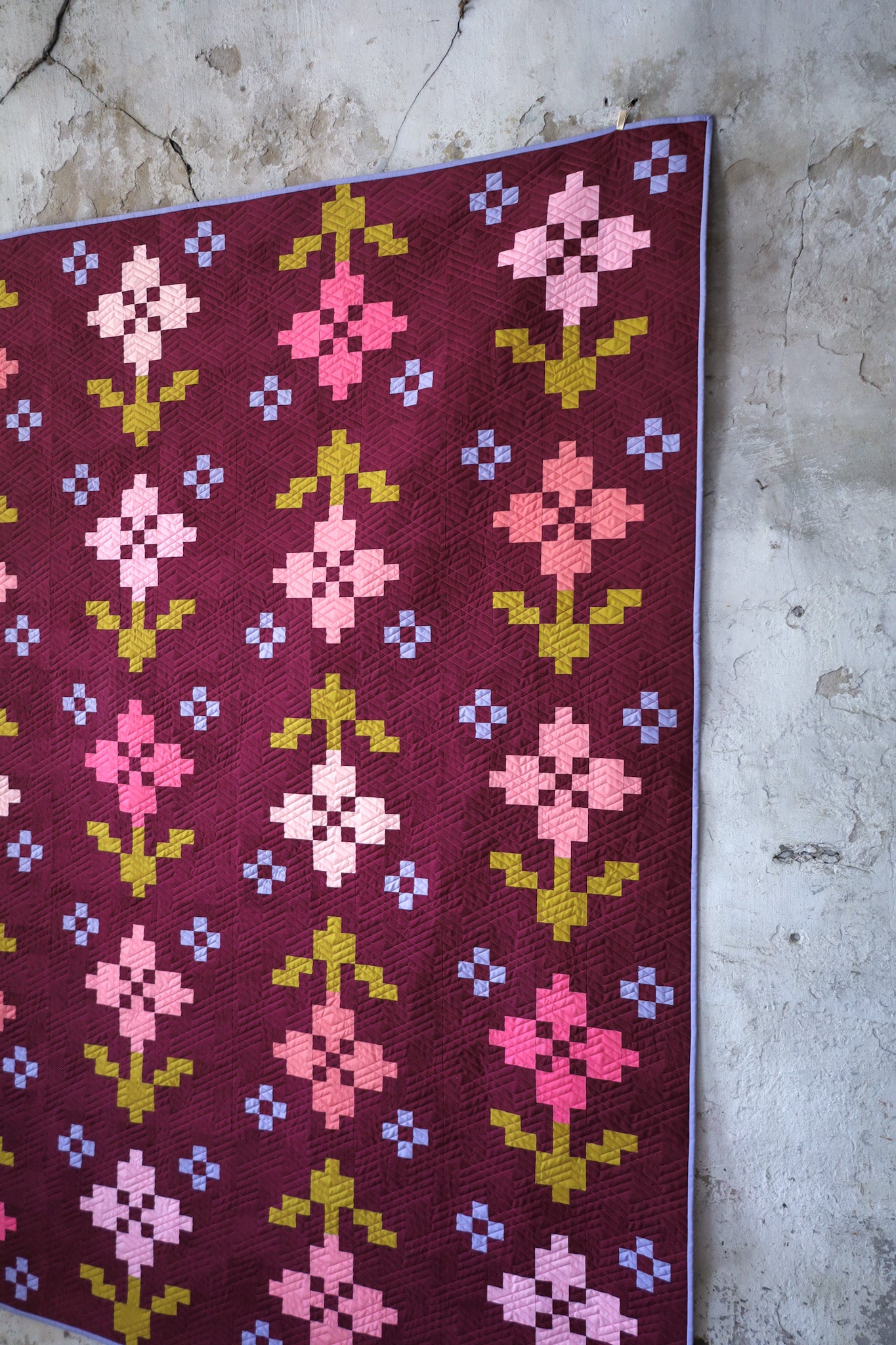 Pansy Patch cover quilt. A quilt pattern by Lo & Behold Stitchery. Nine sizes, 3 colorways, fat quarter friendly.