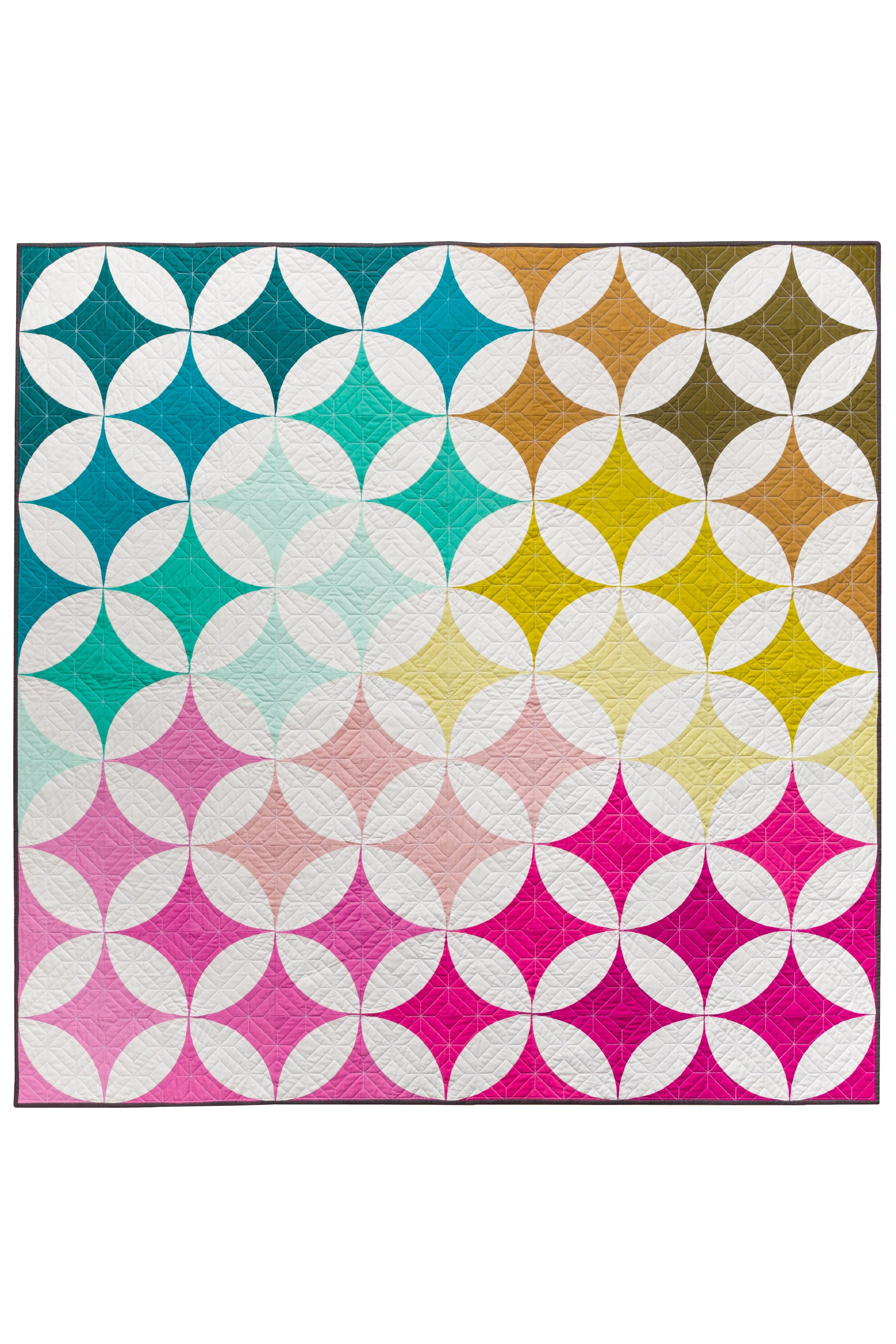 Shades of Citrus 2.0 quilt pattern by Lo & Behold Stitchery featuring an orange peel ombre design comes in 7 sizes. Quilt sample shown in pinks, blues, and warm neutrals.